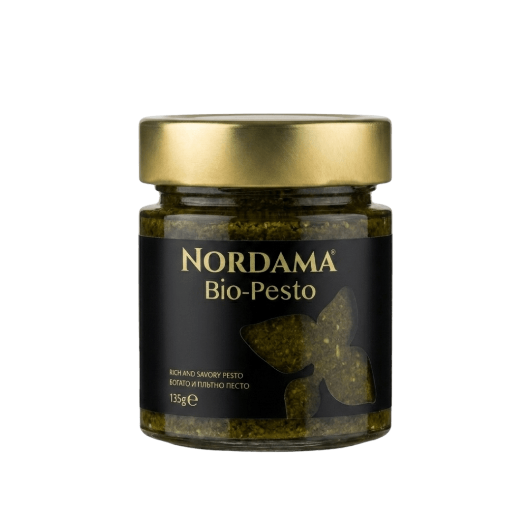 Nordama Bio-Pesto jar with black label and gold lid on a white background